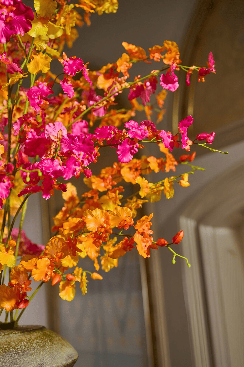 Luxurious bouquet from the Diamond Collection featuring vibrant oranges, yellows and fuchsias with real touch Oncidium sprays, crafted from exclusive Ibiza weddings and interiors.